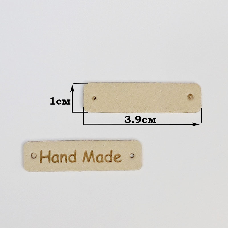 картинка Бирка кожаная "Hand made" 39×10мм цв.бежевый от магазина Пряжа Макошь Ярославль