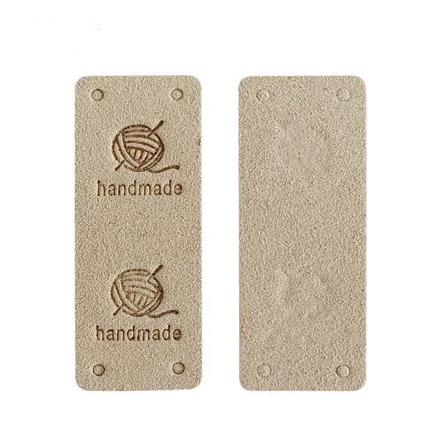картинка Бирка кожаная "Hand made" 50×20мм цв.бежевый от магазина Пряжа Макошь Ярославль
