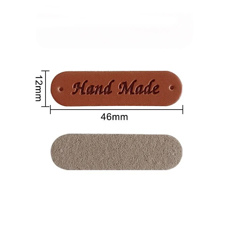картинка Бирка кожзам "Hand made" 46×12мм цв.коричневый от магазина Пряжа Макошь Ярославль