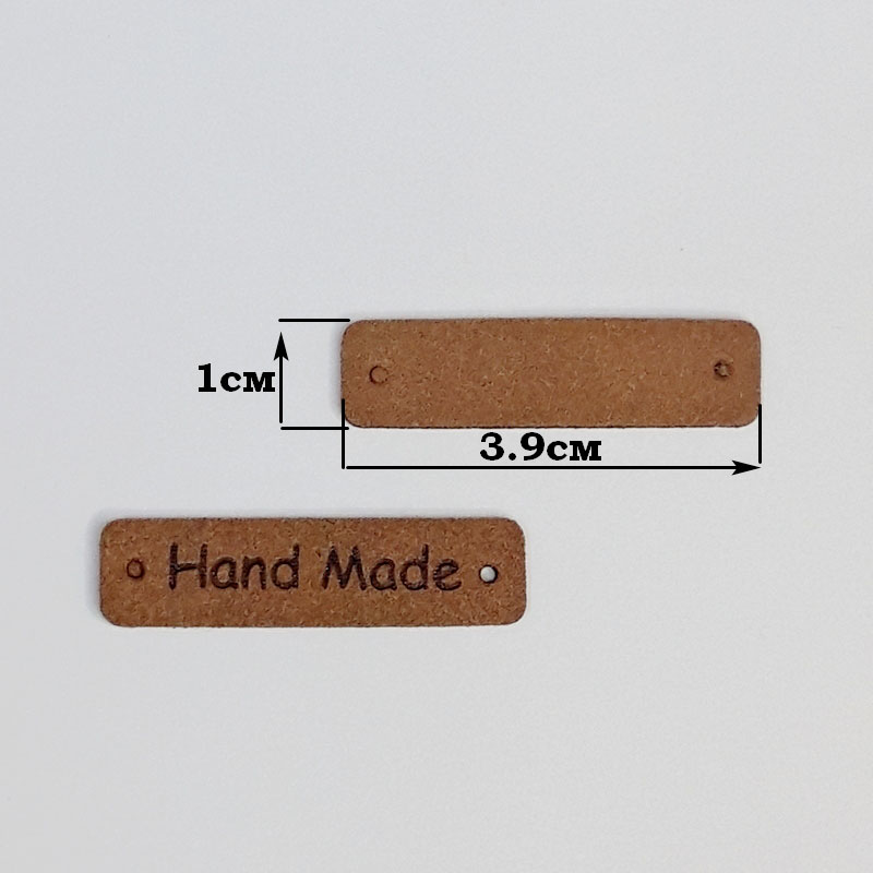 картинка Бирка кожаная "Hand made" 39×10мм цв.коричневый от магазина Пряжа Макошь Ярославль