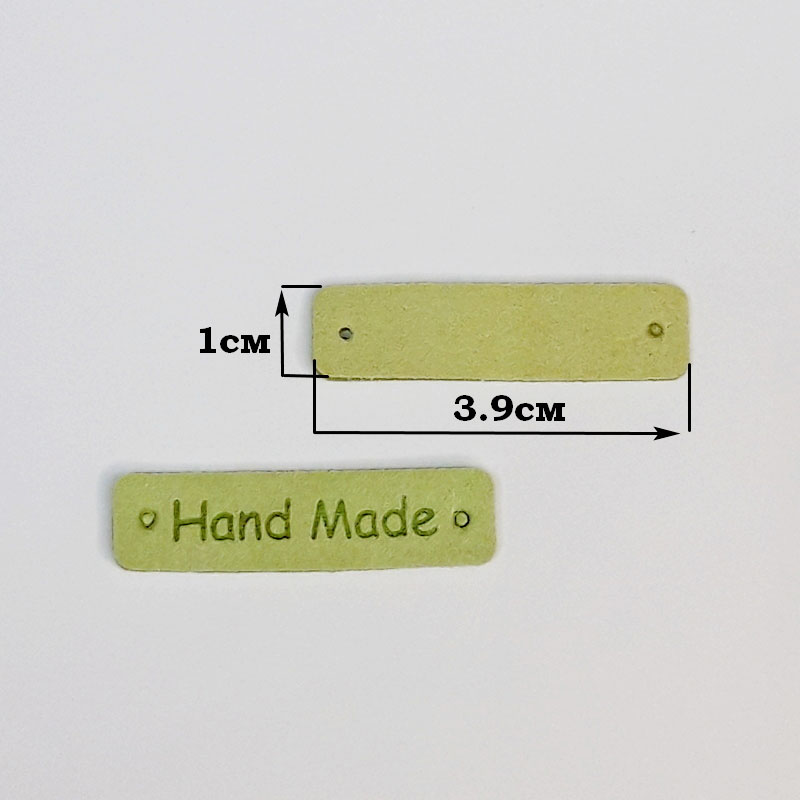 картинка Бирка кожаная "Hand made" 39×10мм цв.зеленый от магазина Пряжа Макошь Ярославль