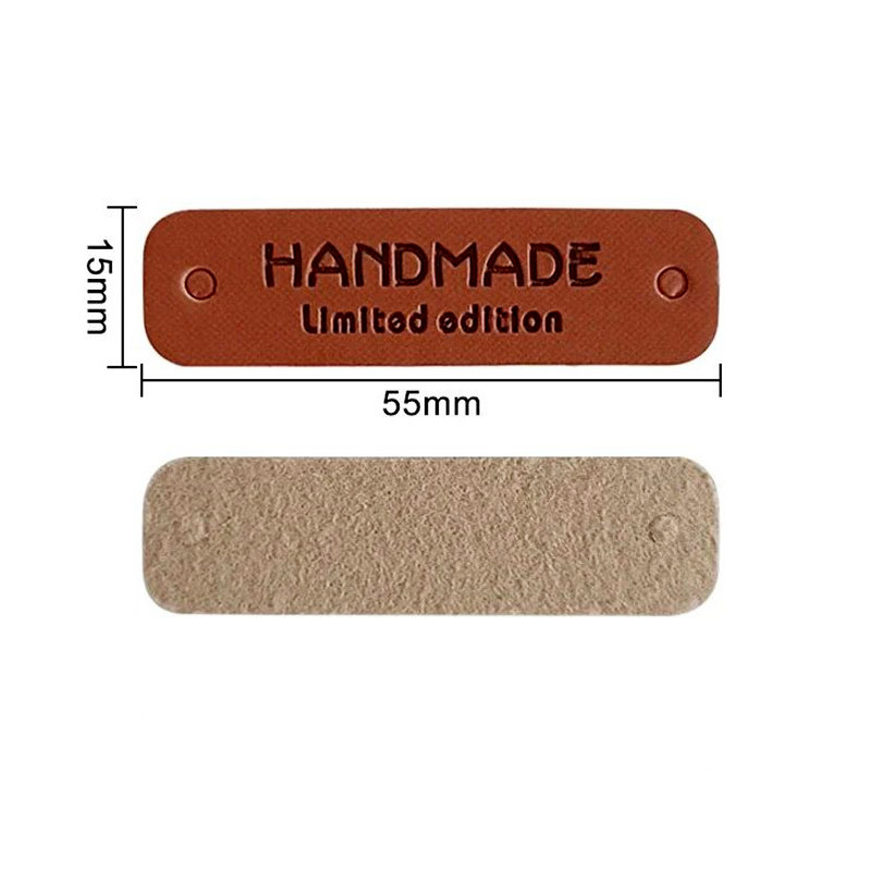 картинка Бирка кожзам "Hand made" 55×15мм цв.коричневый от магазина Пряжа Макошь Ярославль