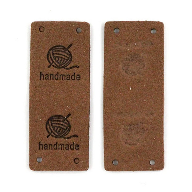 картинка Бирка кожаная "Hand made" 50×20мм цв.коричневый от магазина Пряжа Макошь Ярославль