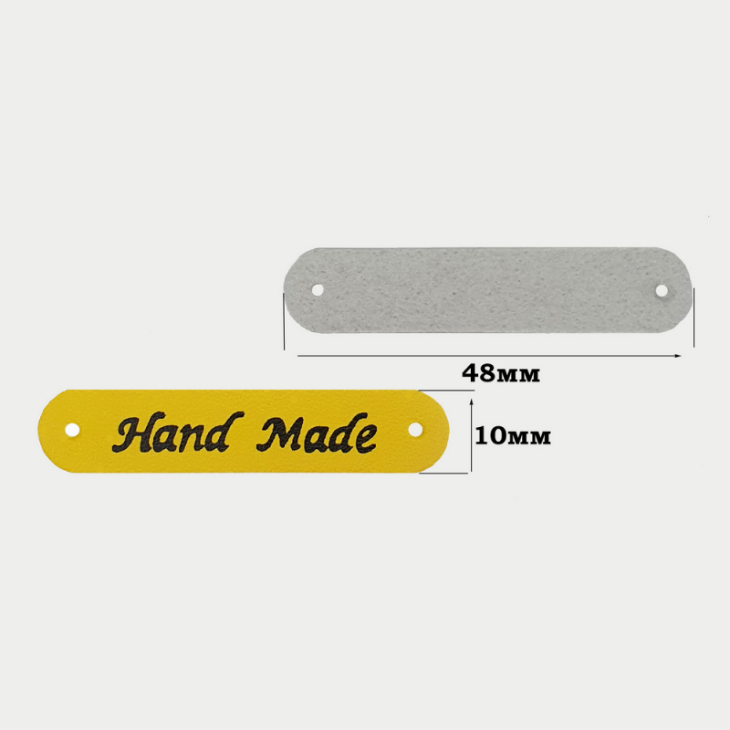 картинка Бирка кожзам "Hand made" 48×10мм цв.желтый от магазина Пряжа Макошь Ярославль
